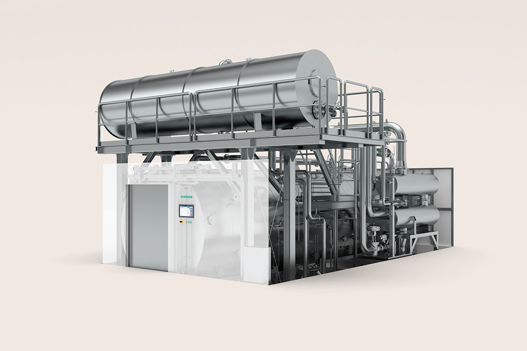 Syntegon Aquatherm hot‑water shower sterilizer with overhead tank and piping; for sealed liquid containers (ampoules, vials); uniform heat via guided water distribution.