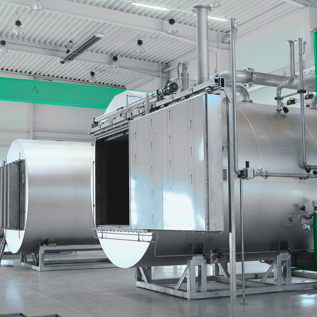 Syntegon pharmaceutical autoclave sterilizers on a manufacturing floor, showcasing over 50 years of sterilization expertise and more than 2,000 installed units across 50+ countries.